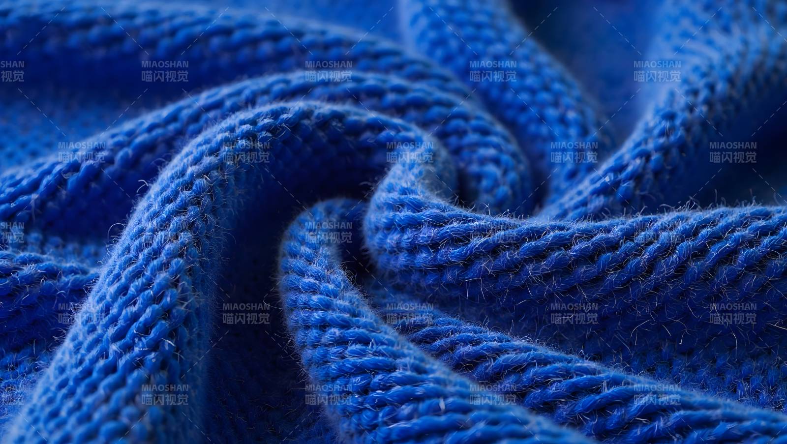 蓝色针织纹理特写图片