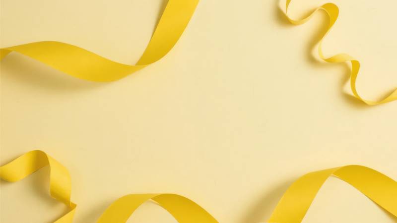 黄色丝带飘逸背景图片