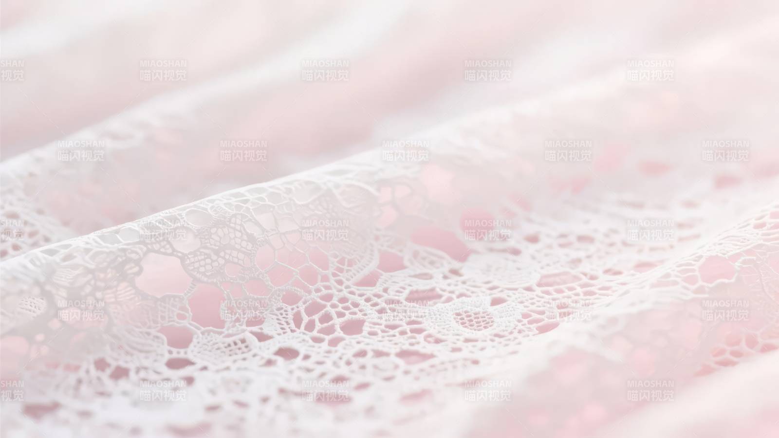粉色蕾丝布料特写图片