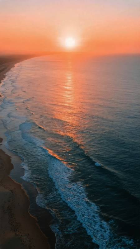 夕阳海浪沙滩图片