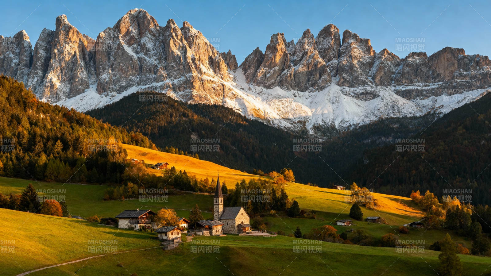 雪山下的宁静村庄图片