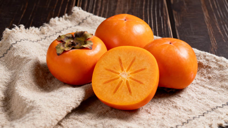 柿子切开鲜橙色图片