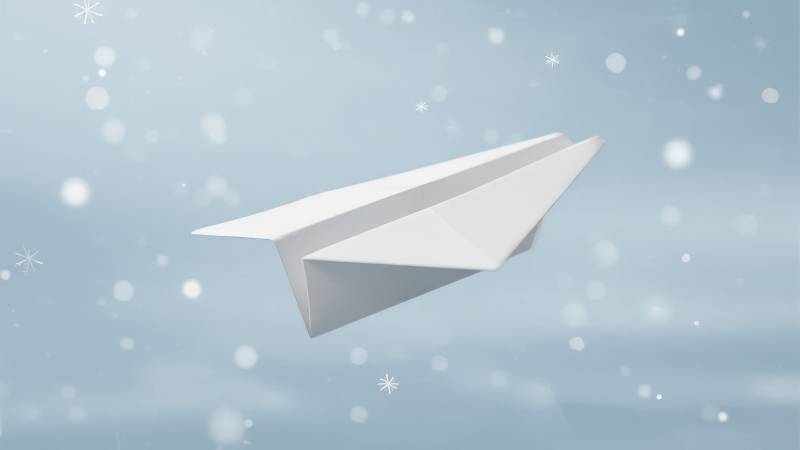 纸飞机飞雪中图片