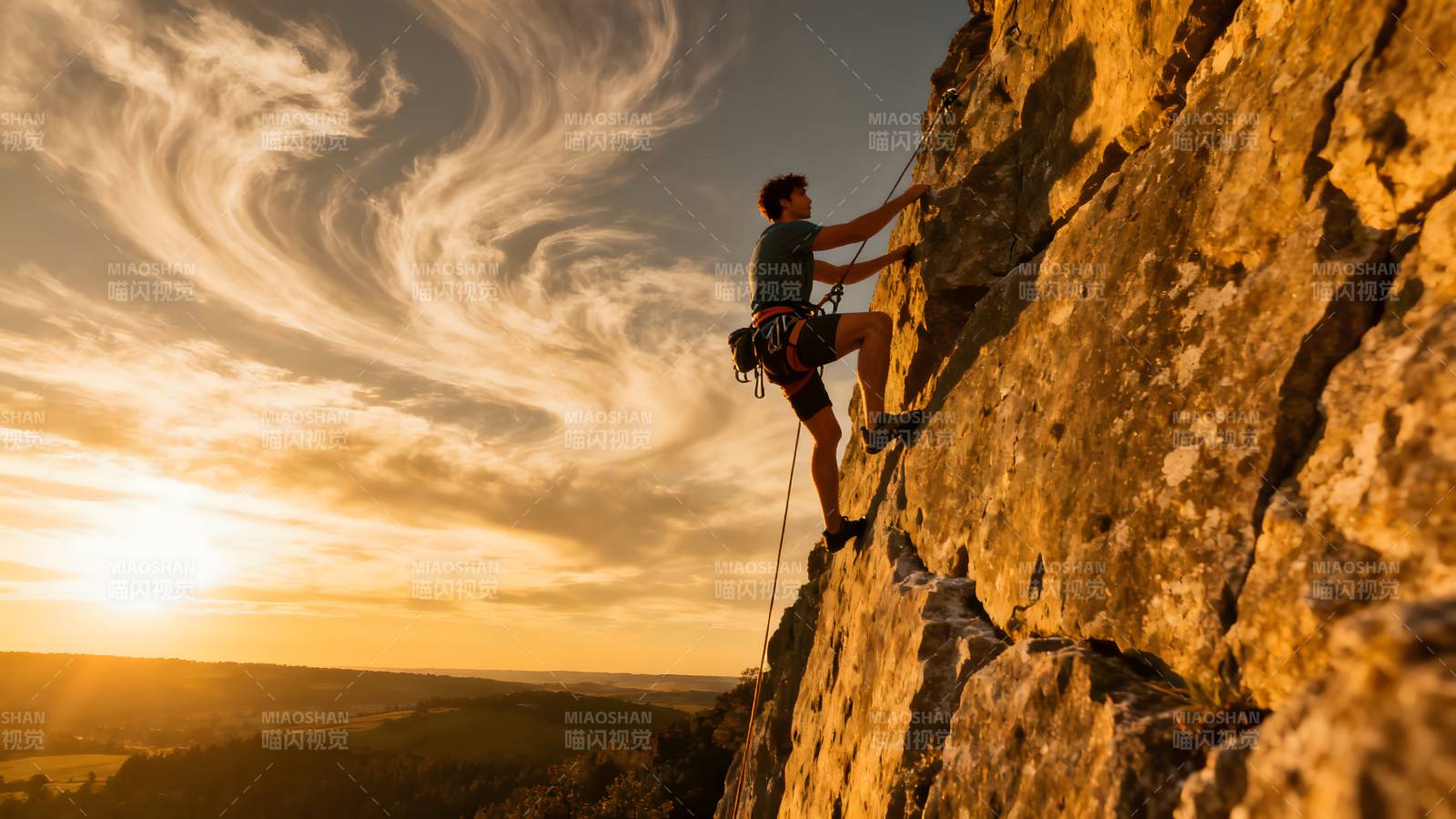 攀岩者挑战峭壁图片