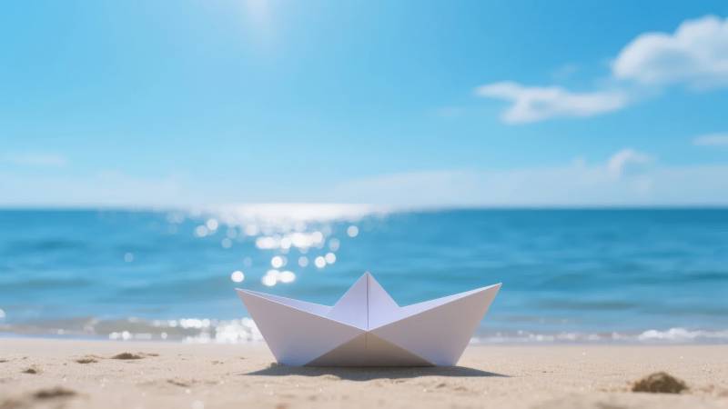 纸船沙滩海景图片