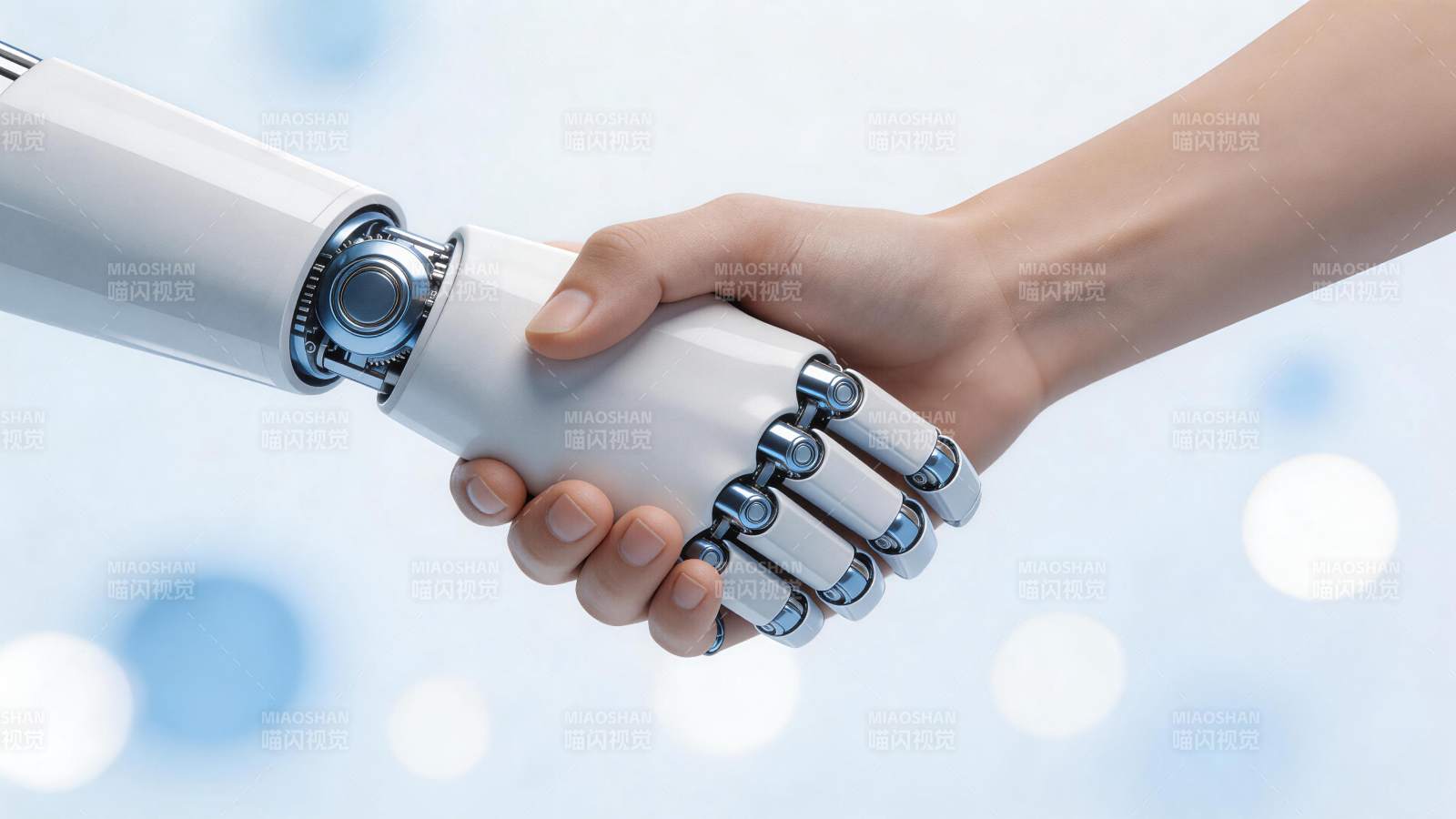 人类手掌与机械手臂握手特写画面图片