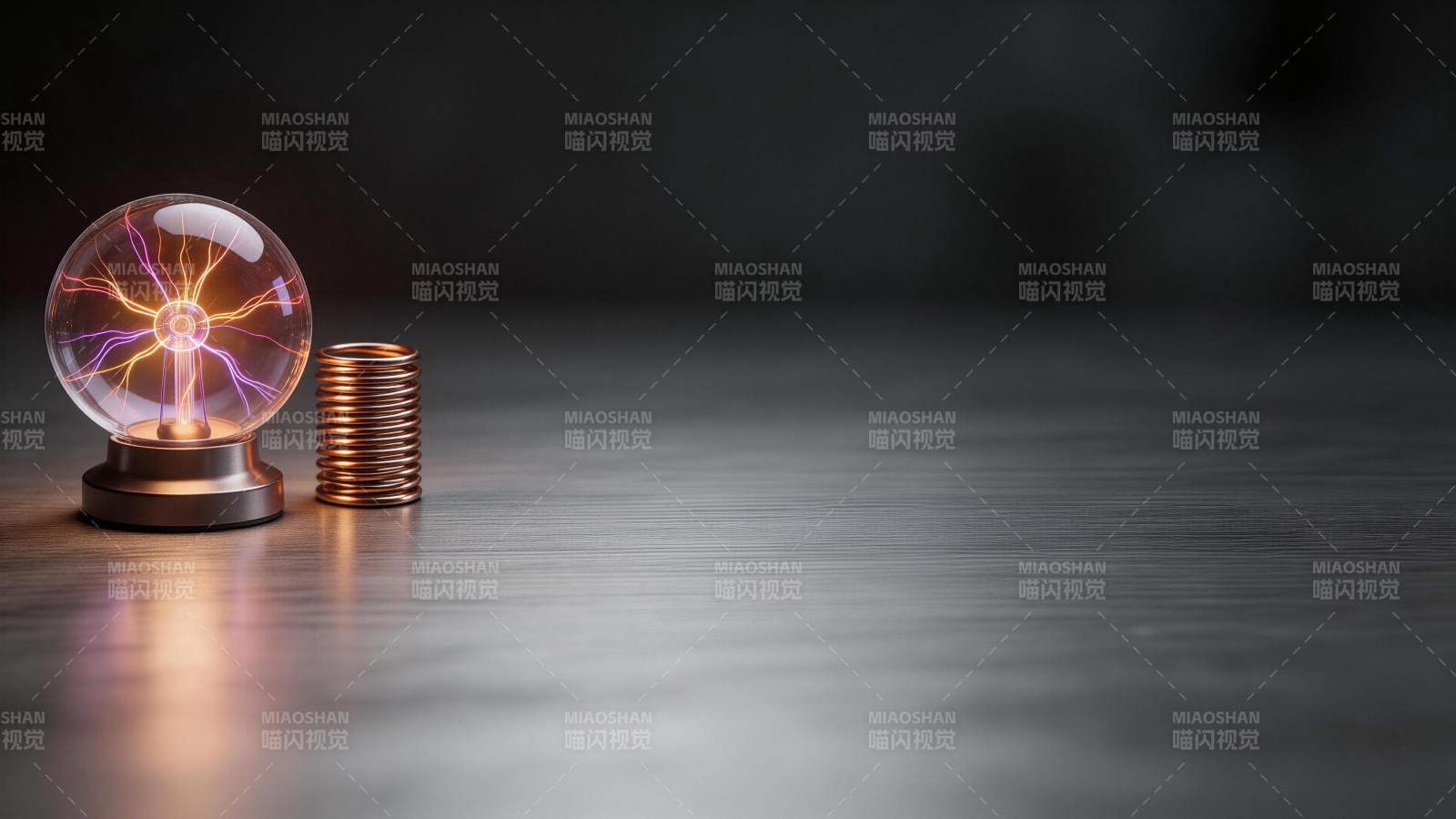 静电球与铜线圈置于深色桌面展示图片