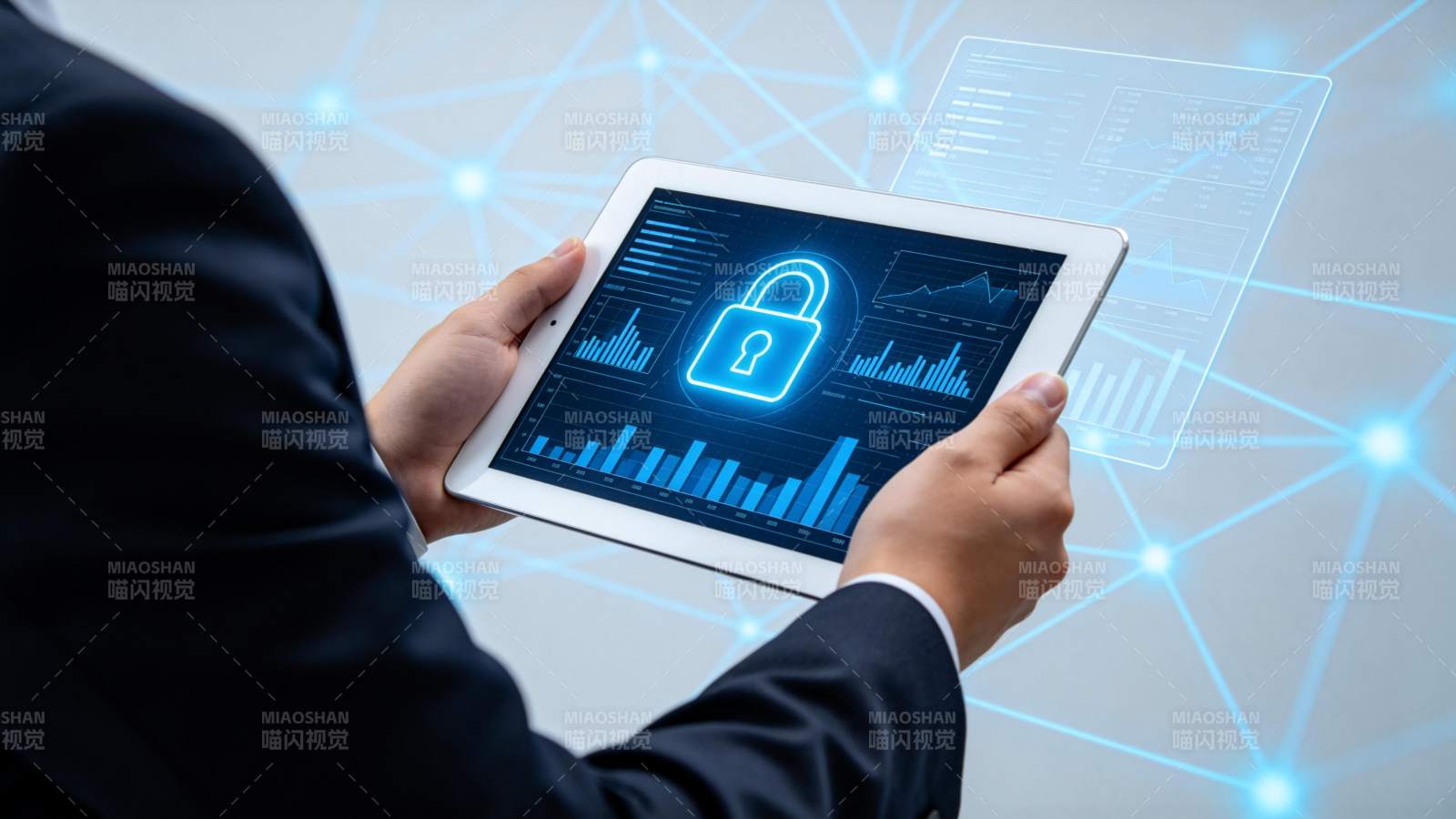 商务人士手持平板展示网络安全数据图表图片