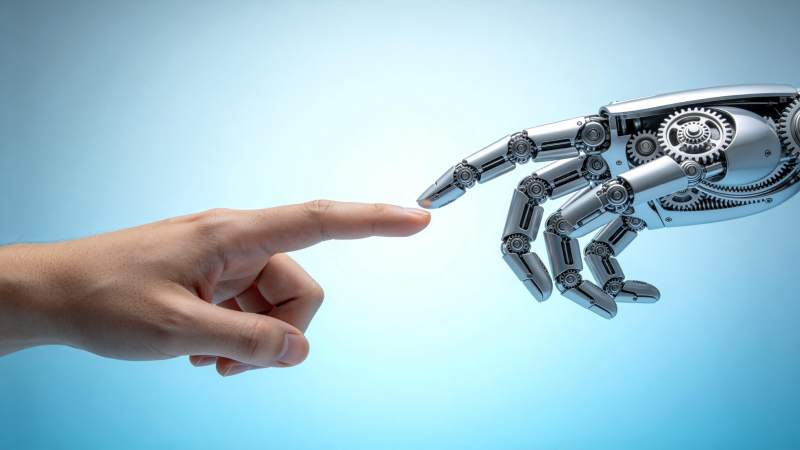 人类手指与机械手指即将触碰的瞬间图片