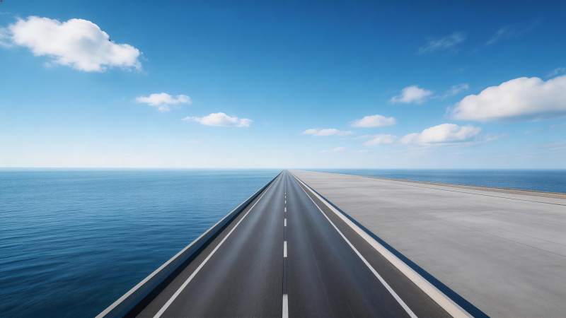 笔直公路延伸至海天交界处的开阔景象图片