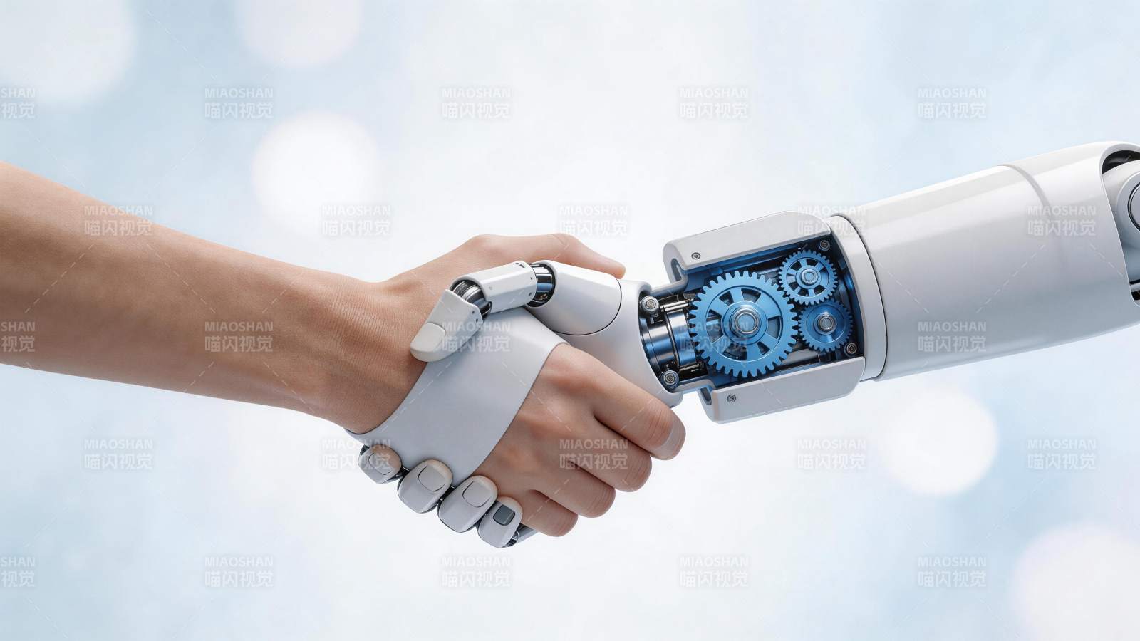 人类手掌与机械手臂握手特写画面图片