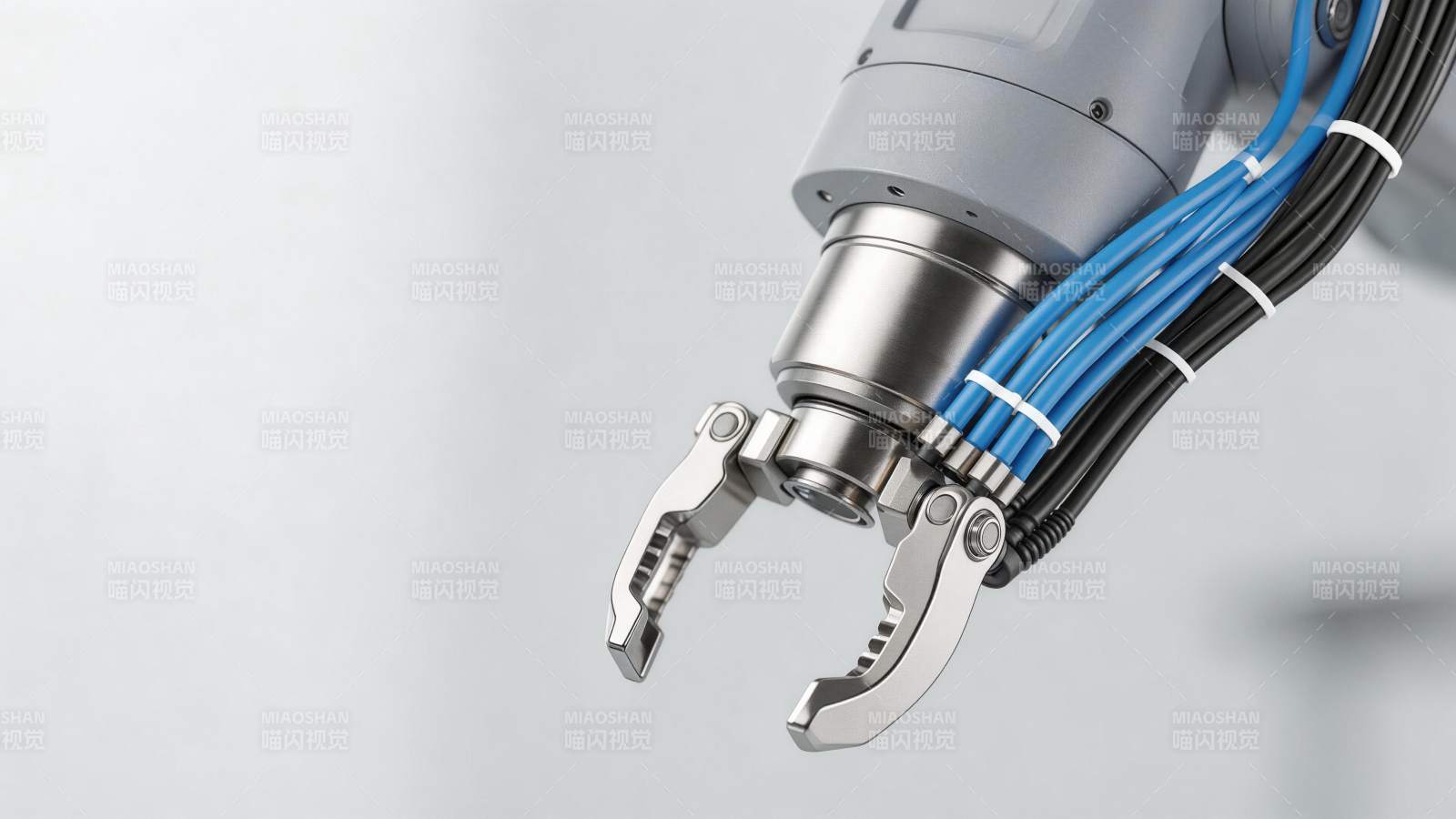 工业机械臂末端夹爪与线缆特写图片