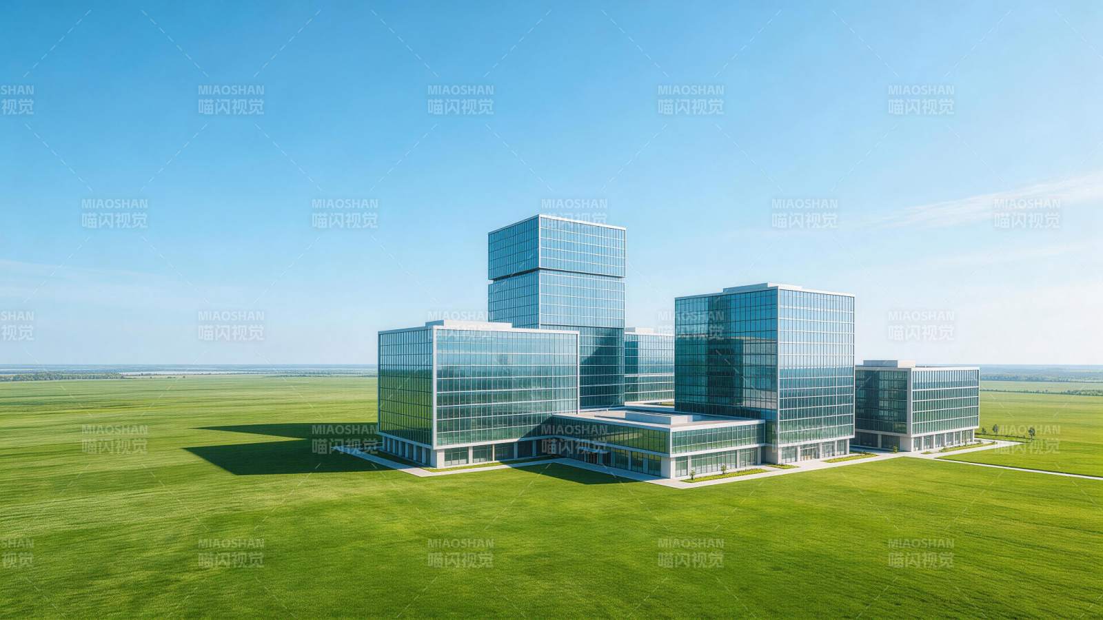 玻璃幕墙现代建筑群矗立于广阔绿野之中图片