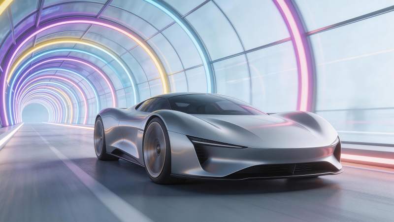 银色未来感跑车穿行霓虹隧道图片