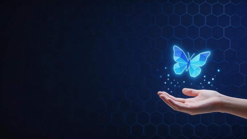 手掌托举蓝色几何蝴蝶数字影像图片