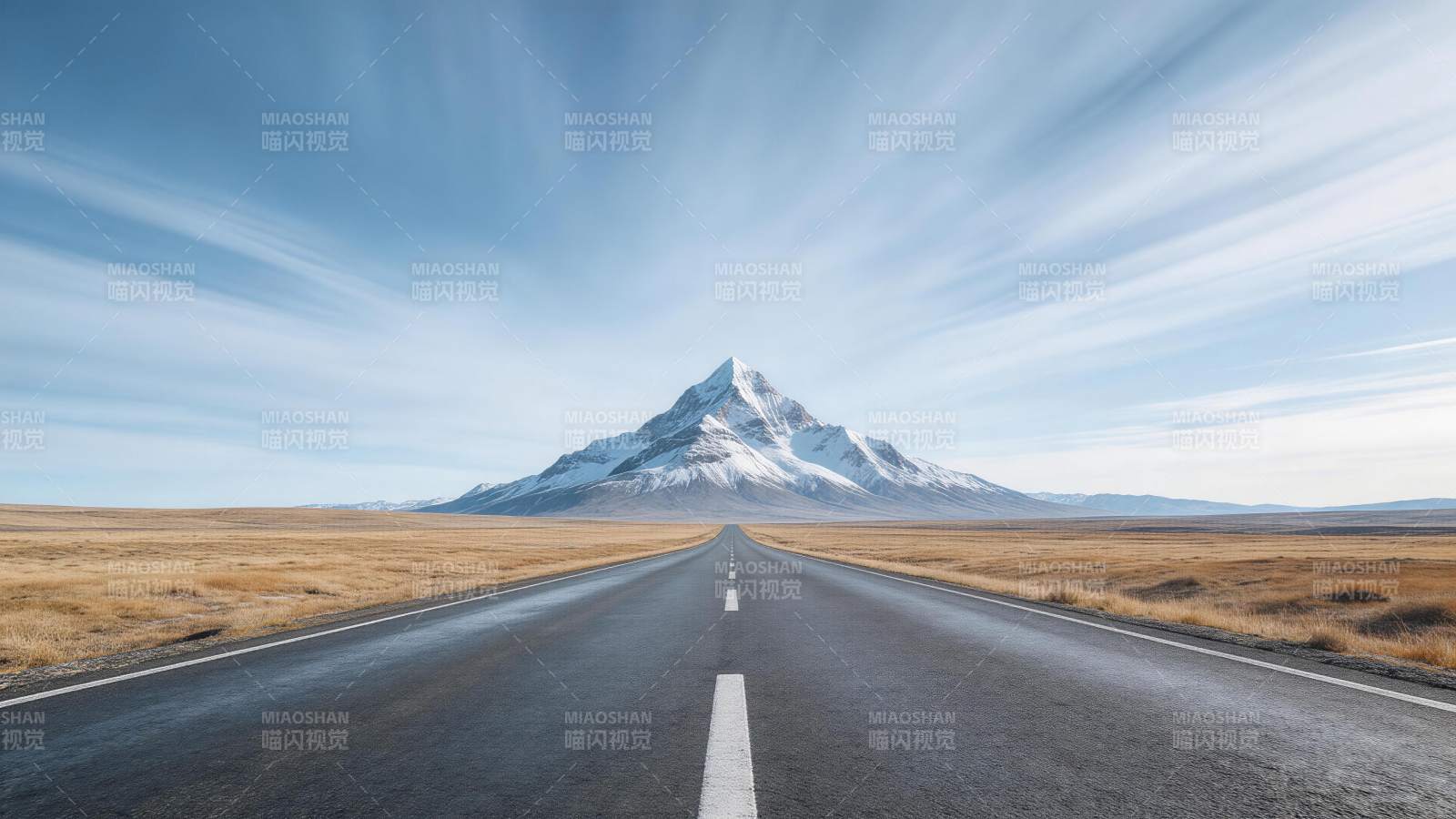 笔直公路通向雪山峰顶的壮丽自然景观图片