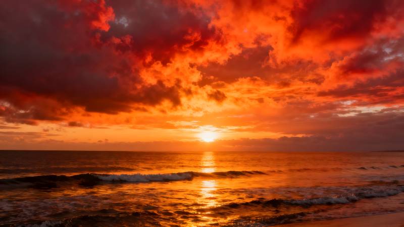 烈焰海天日落图片