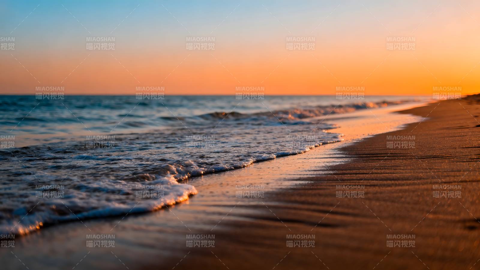 夕阳沙滩海浪图片