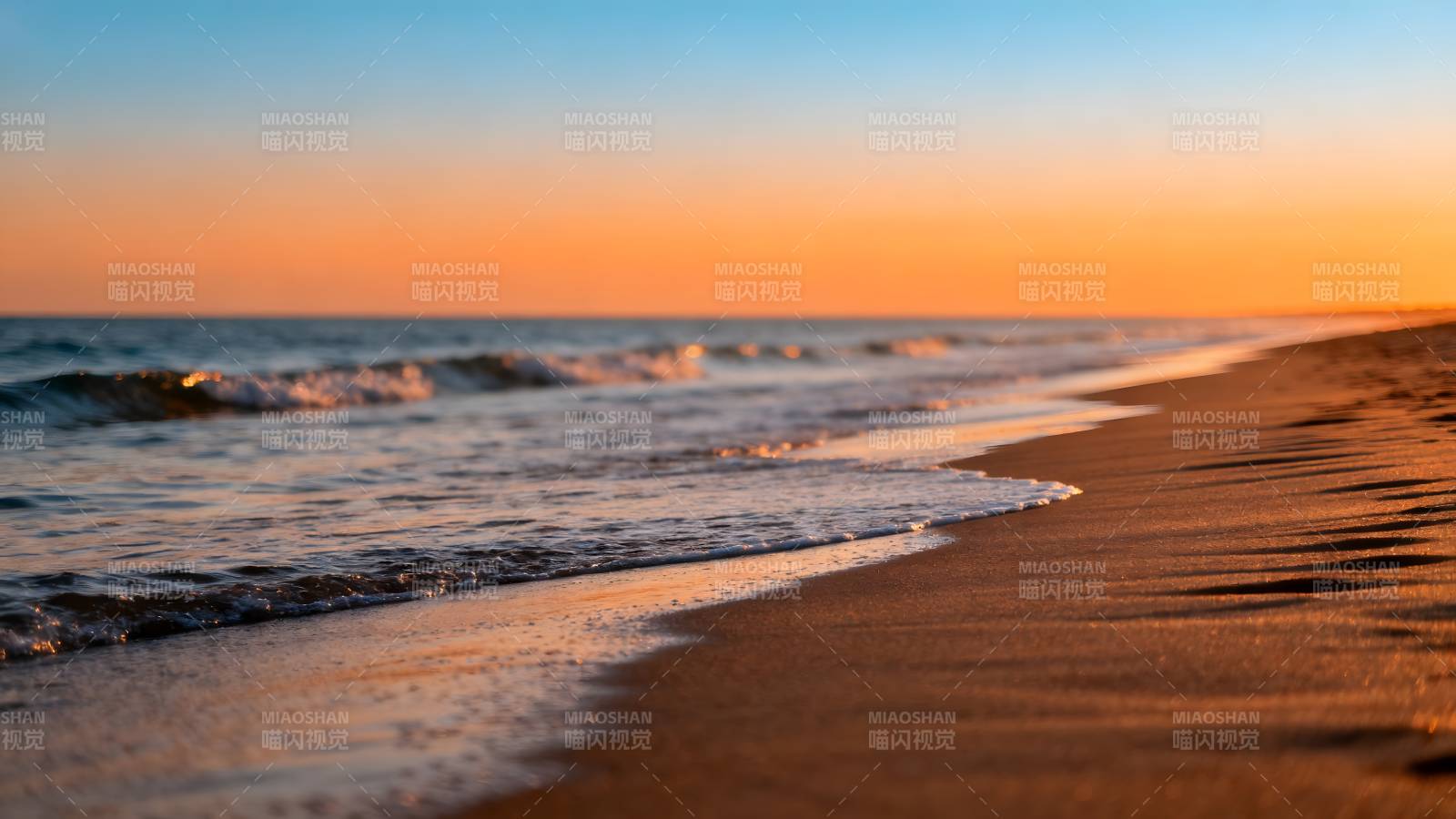 夕阳沙滩海浪图片