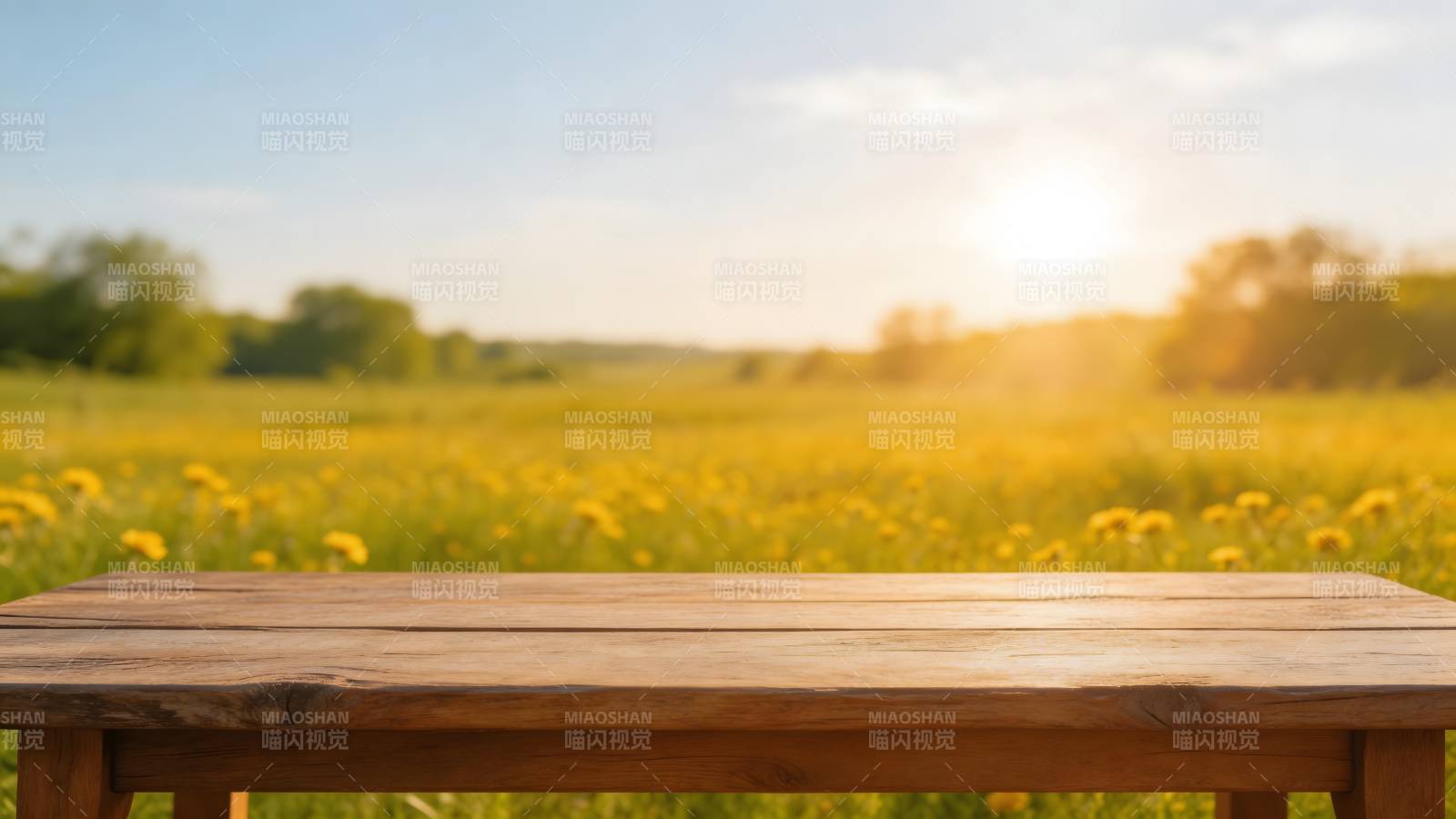 木桌前的花海日落图片