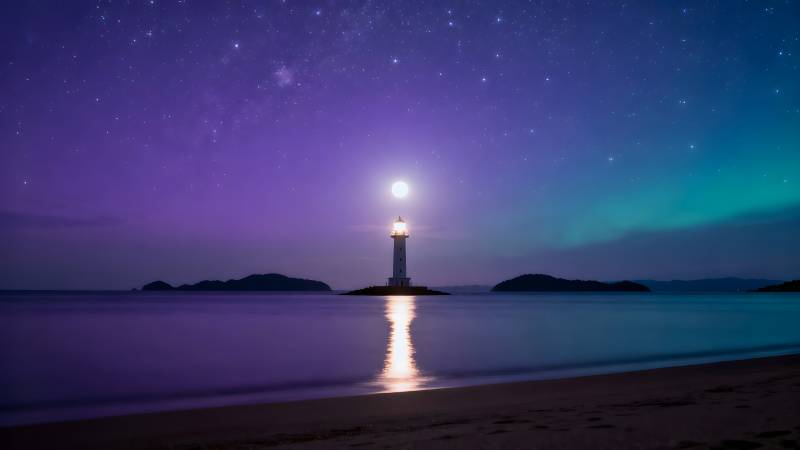 星夜灯塔映海光图片