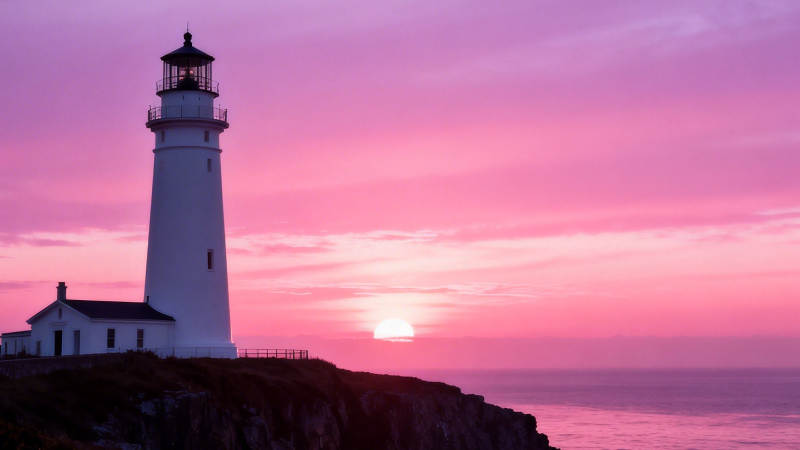 粉霞灯塔映海日图片