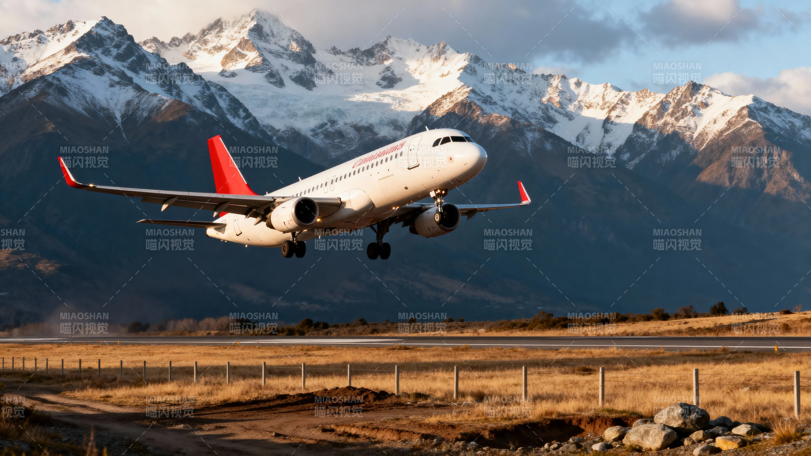 雪山下的飞机起飞瞬间图片