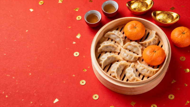 新春蒸饺配金橘 喜庆团圆年图片