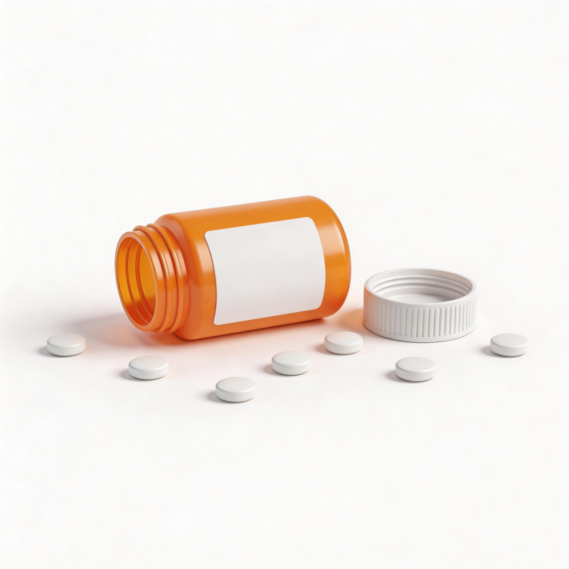 药瓶倾倒 白色药片散落图片