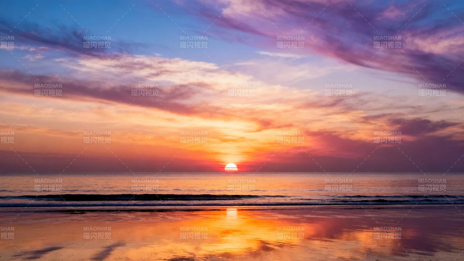 夕阳染海天 霞光映沙滩图片
