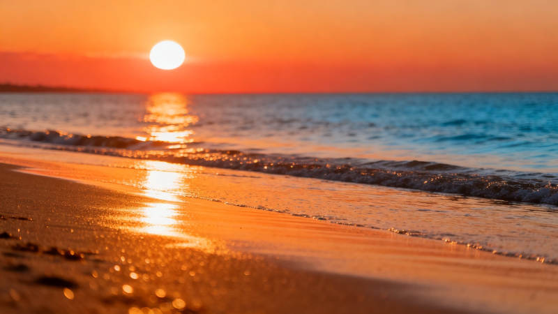 夕阳金浪吻沙滩图片