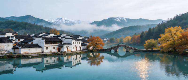 秋韵古村 桥影映水山含雪图片