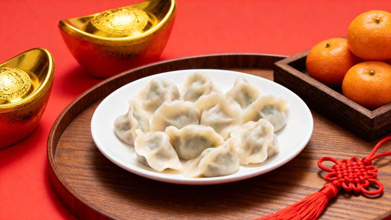 春节饺子配金元宝橘子图片